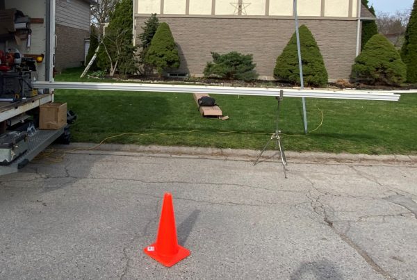 custom seamless eavestrough created on site with special machine on back of truck