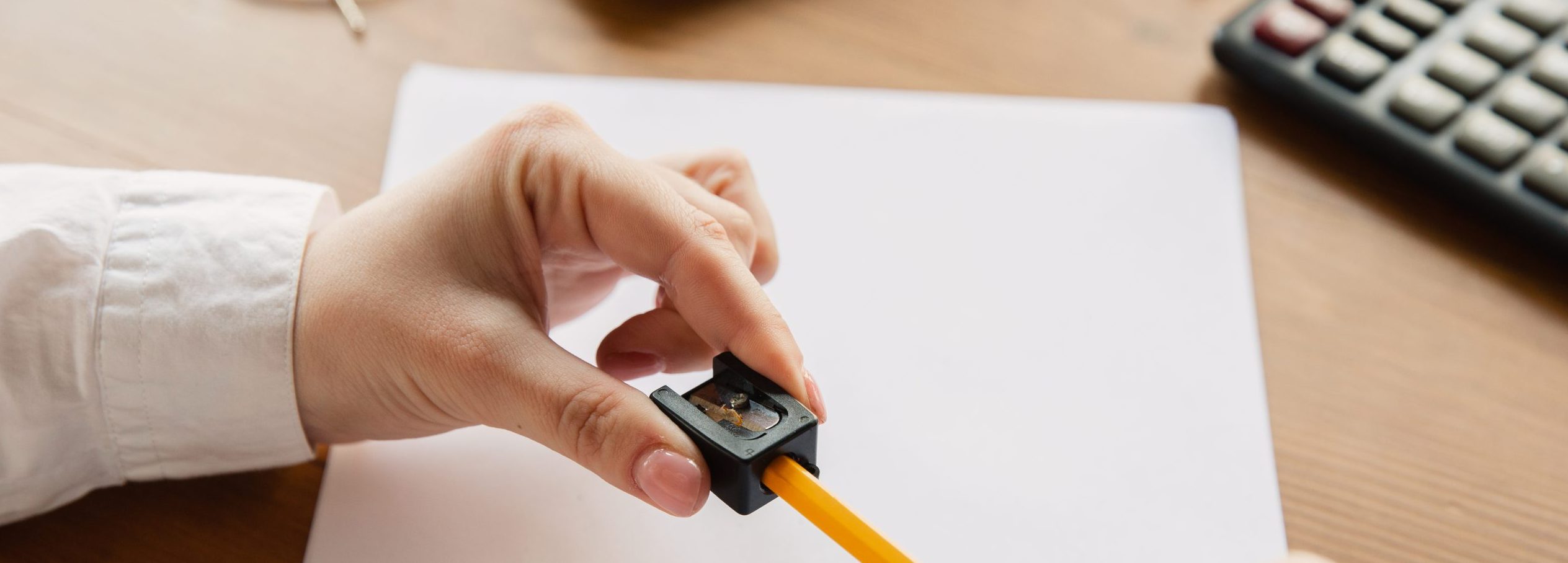 Sharpen a pencil. representing ways to save money